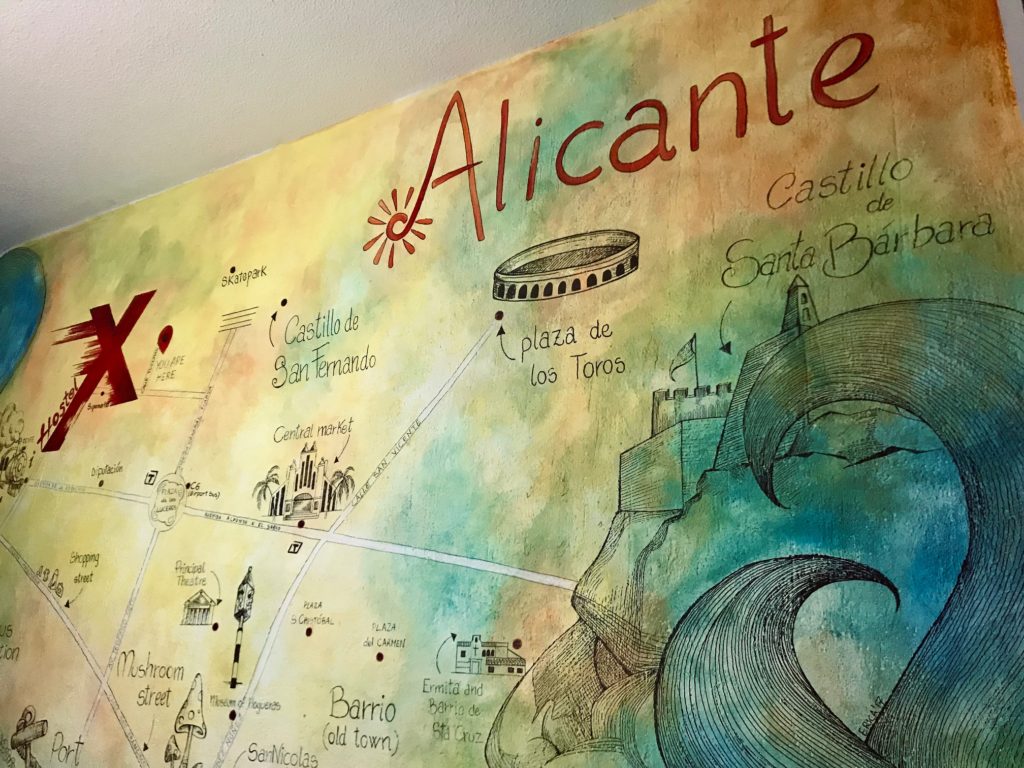 The mural of Alicante on X hostel wall helped me plot out this Alicante Itinerary and all the things we would see in the city. 