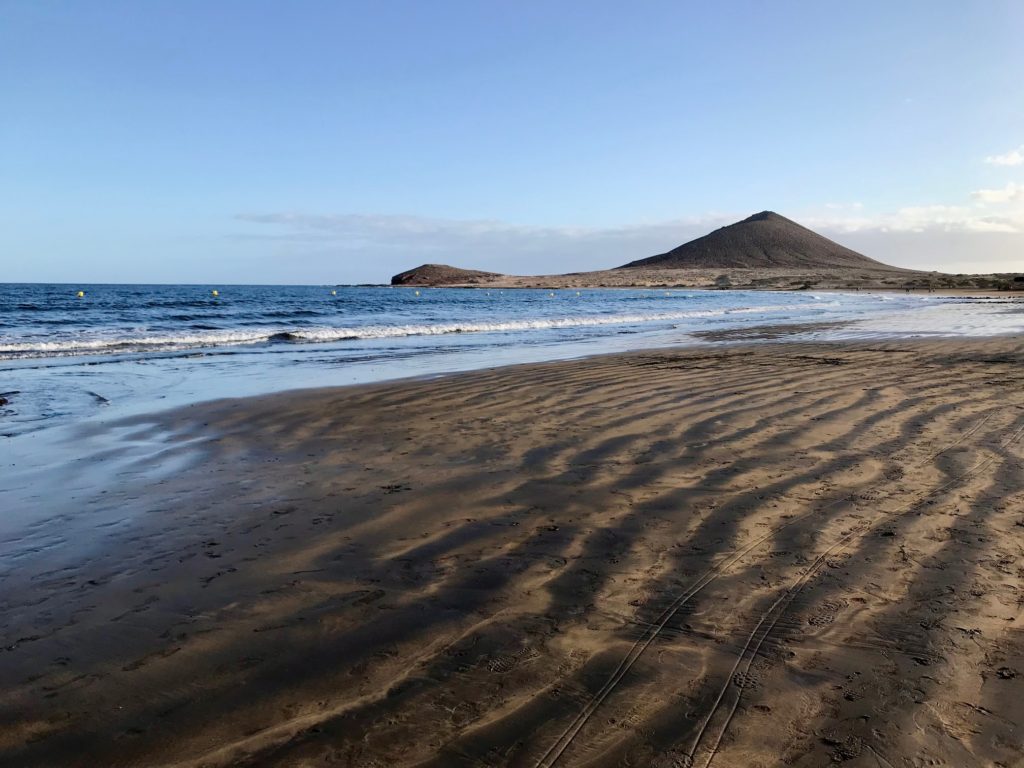 The black and tan striped beachers of El Médano are some of the most unique on the Island of Tenerife. The town gets its name from the large sand dunes that sit at the end of the beach. 