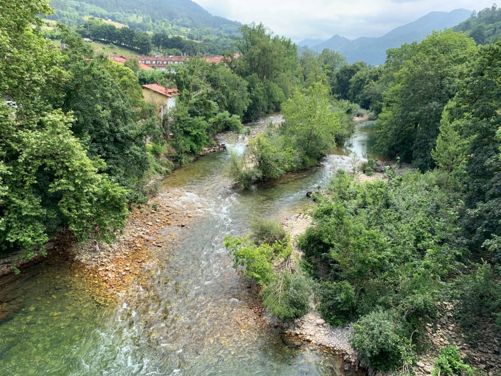 a river running through cangas de onis and the picos de europa